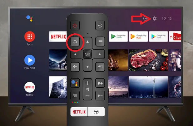 Botón Home en un mando de Smart TV TCL Android. De fondo una TV TCL